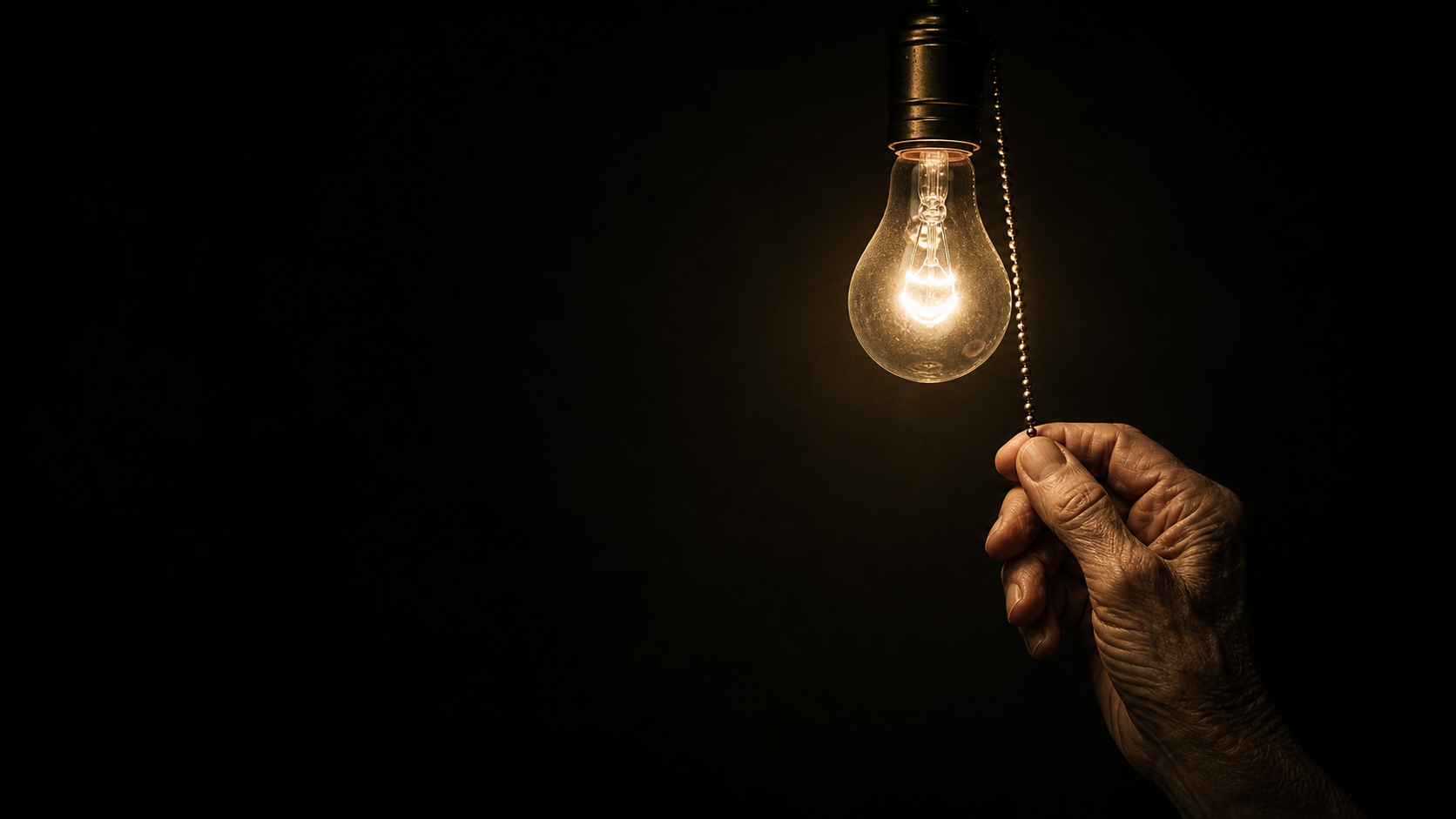 hand reaching for light bulb